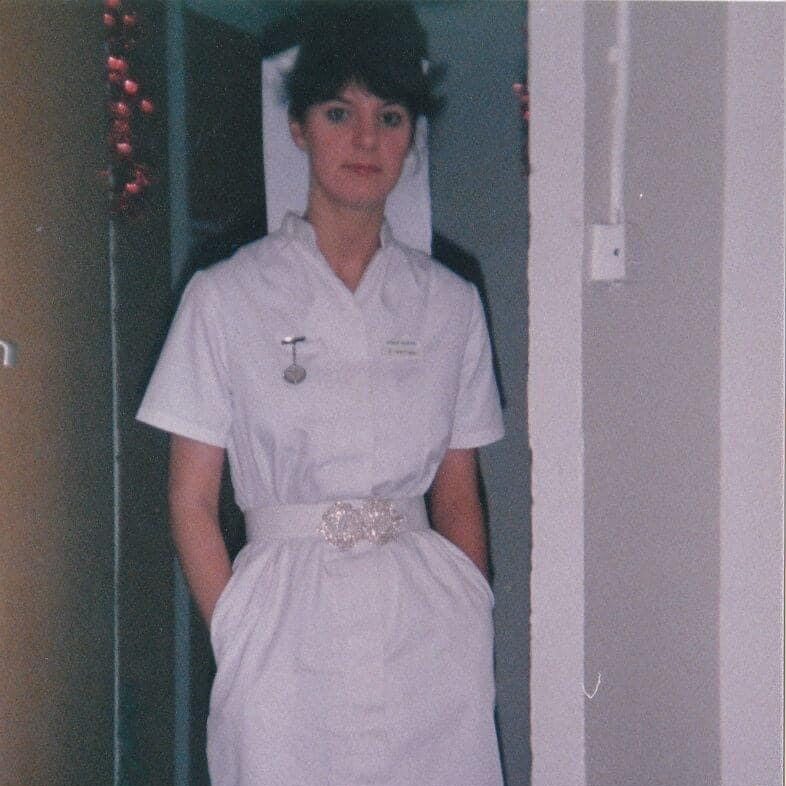 Carolyn in nursing uniform in 1985 smiling 